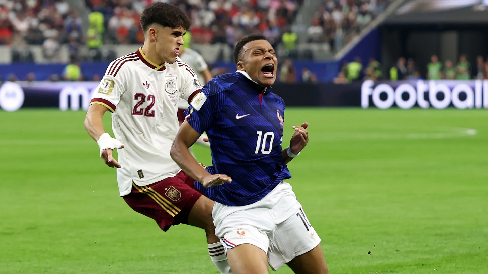 Kylian Mbappe #10 of France is challenged by Pau Cubarsi #22 of Spain