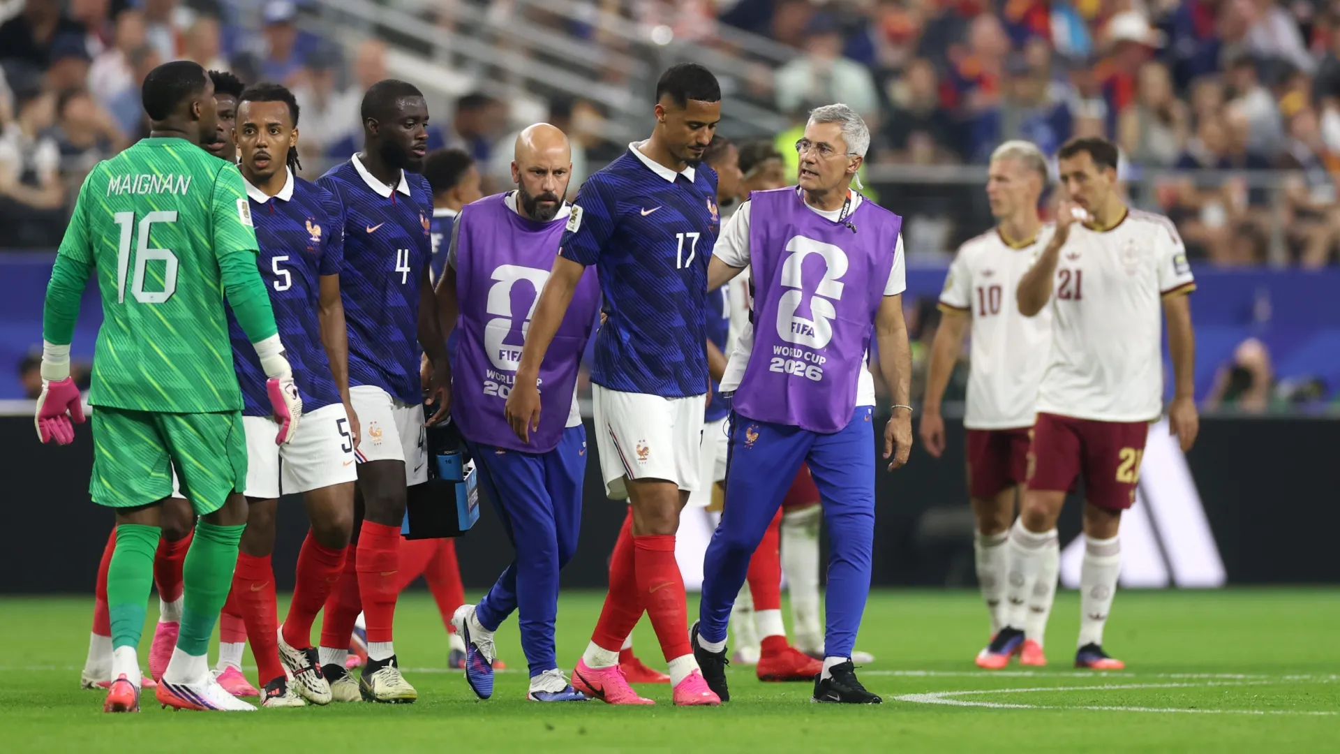 William Saliba #17 of France walks off the pitch with medical staff after sustaining an injury. Lars Baron/Getty Images