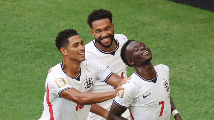 Bukayo Saka #7 of England celebrates with Jude Bellingham and Reece James.