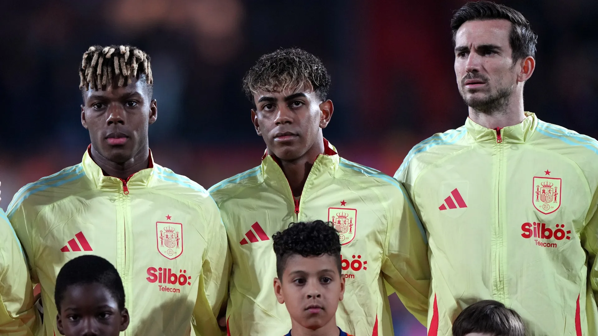 Nico Williams, Lamine Yamal and Fabián Ruiz during the national anthem ahead of the UEFA Nations League quarterfinal leg one match (Source: Alex Bierens de Haan/Getty Images)