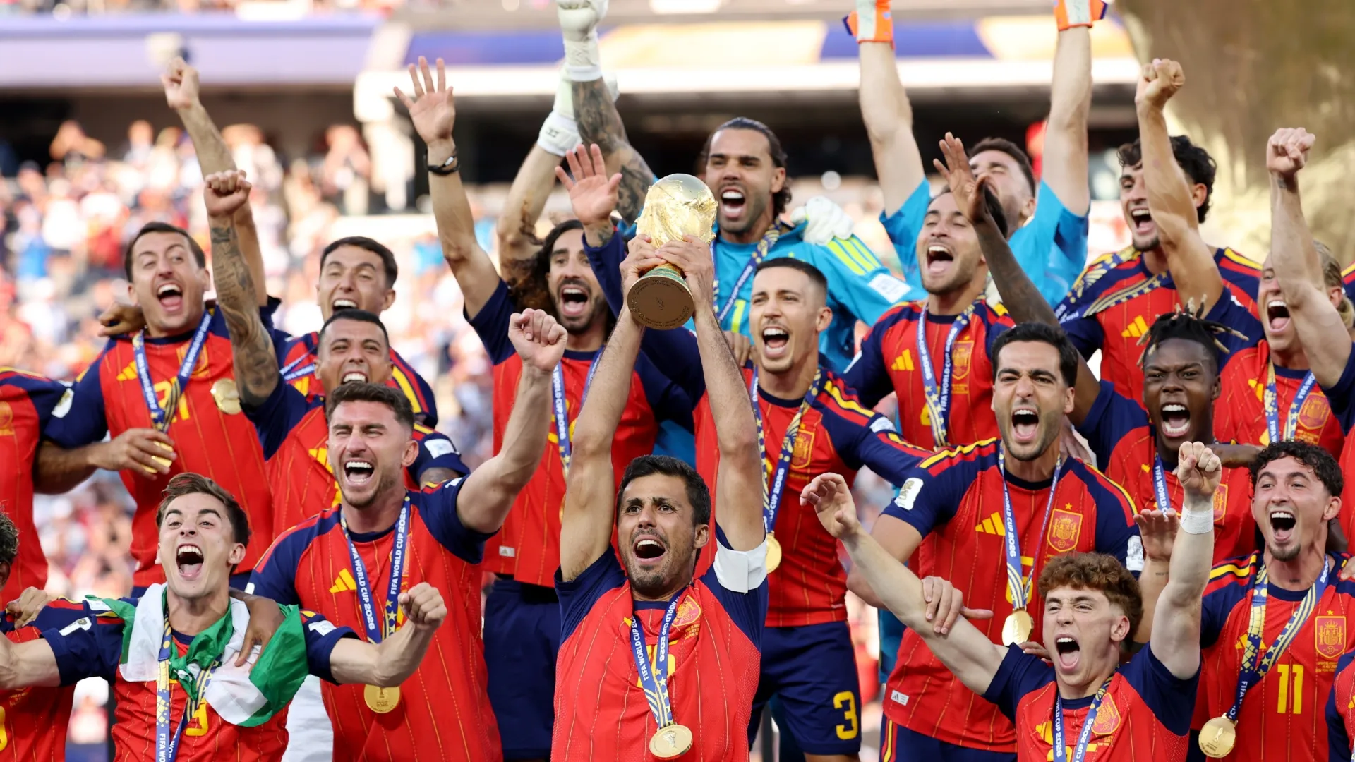Rodri lifting the FIFA World Cup trophy after Spain's win in 2026.