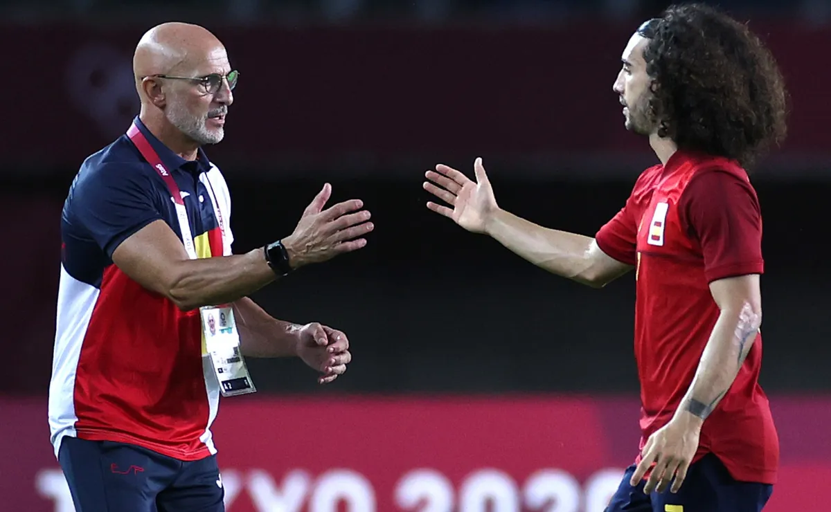 luis-de-la-fuente-holds-marc-cucurella-to-tattoo-promise-after-spain