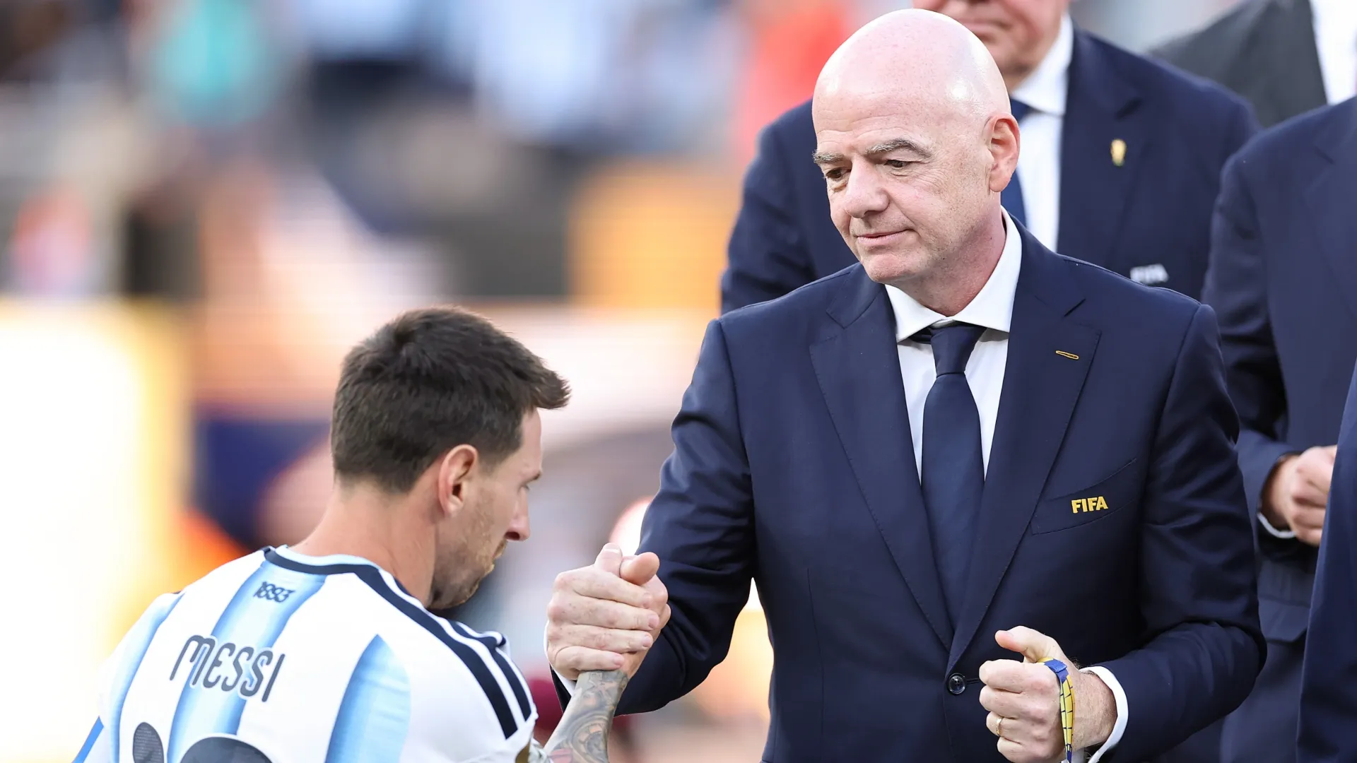 Gianni Infantino shakes hands with Lionel Messi after 2026 World Cup final.