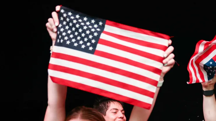 Fans cheer with United States flag