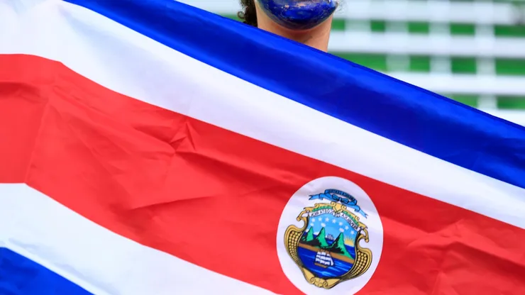 A Costa Rica fan poses with flag
