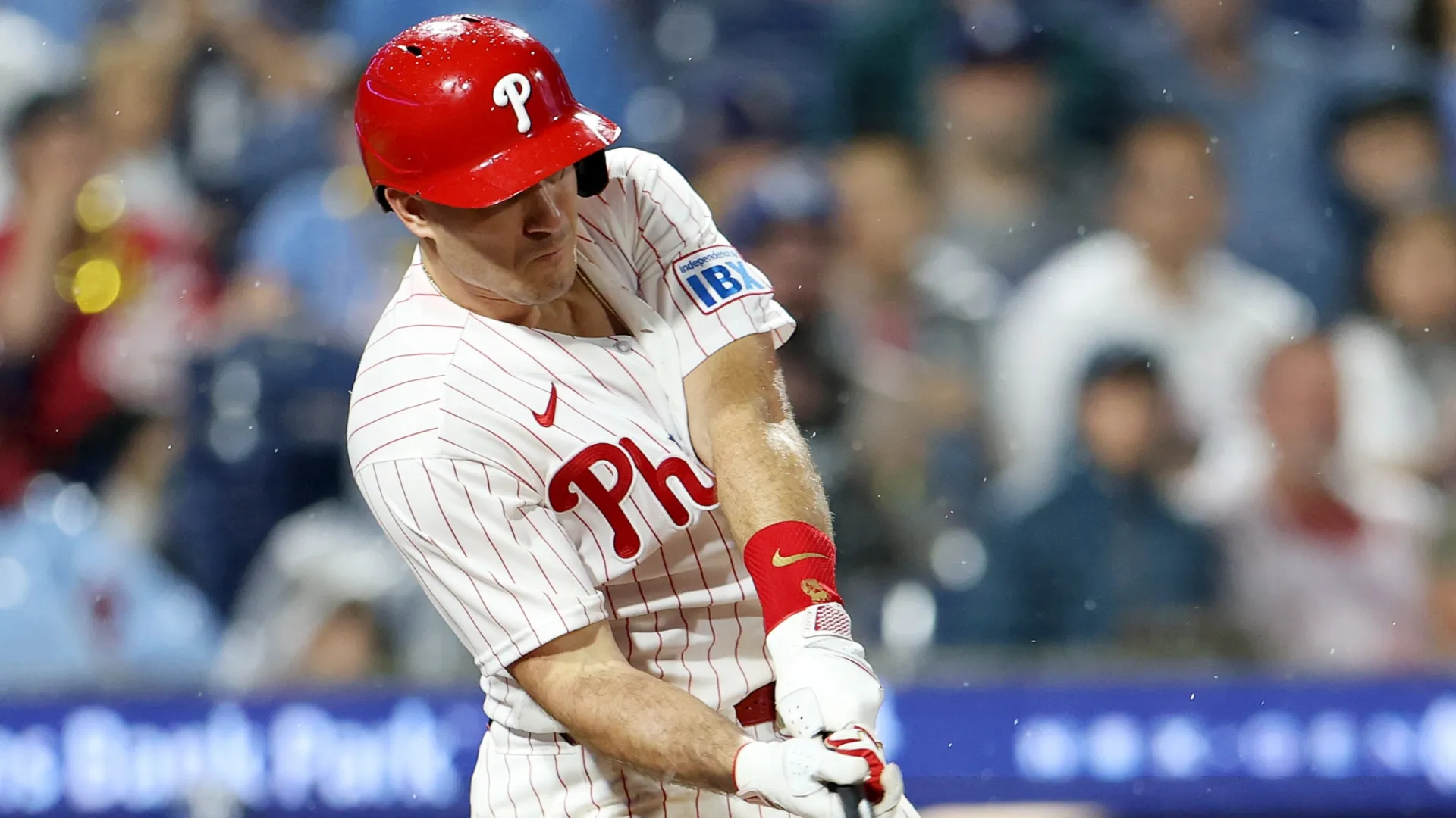 J.T. Realmuto #10 of the Philadelphia Phillies hits a double in the ninth inning. Emilee Chinn/Getty Images