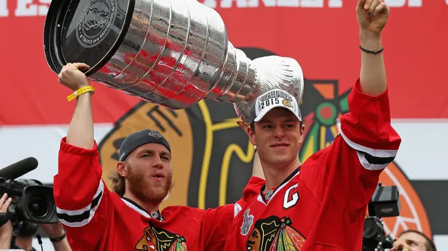 Patrick Kane and Jonathan Toews with the Stanley Cup.