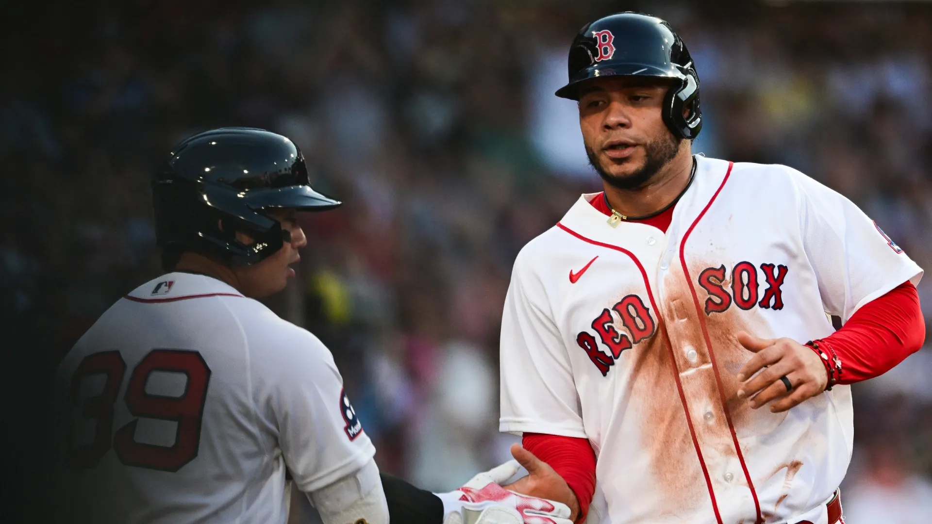 Willson Contreras #40 of the Red Sox is greeted at the dugout. Jaiden Tripi/Getty Images