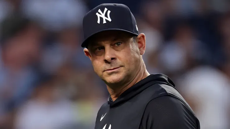 Aaron Boone #17 of the New York Yankees walks back to the dugout.