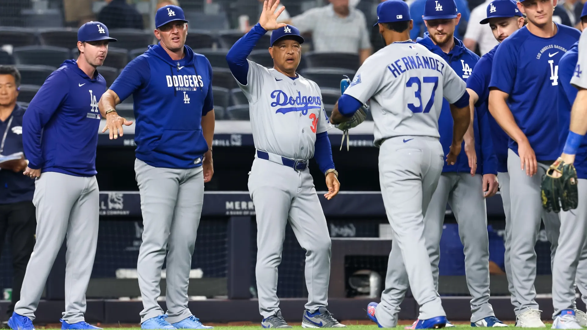 Manager Dave Roberts #30 of the Los Angeles Dodgers celebrates. Caleb Bowlin/Getty Images
