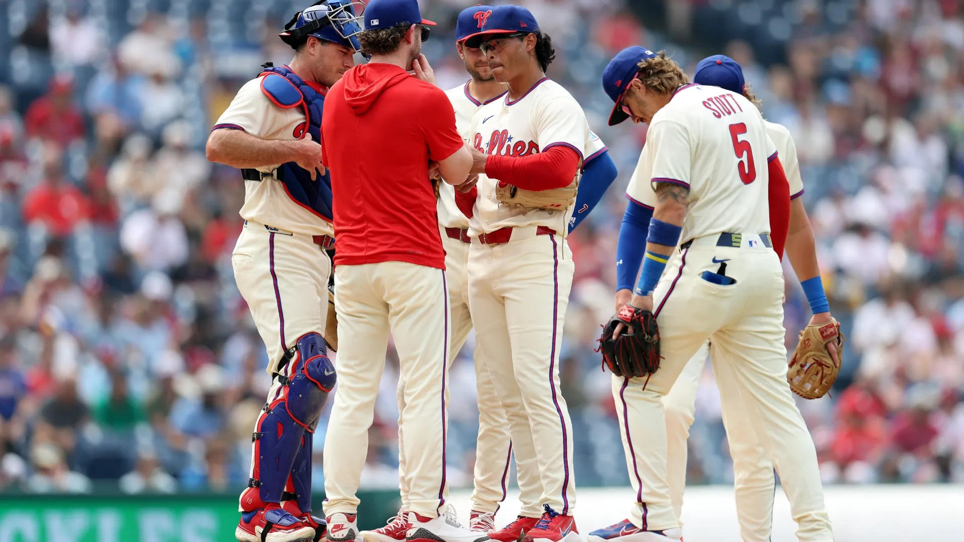 Jesús Luzardo #44 of the Philadelphia Phillies talks to pitching coach. Emilee Chinn/Getty Images