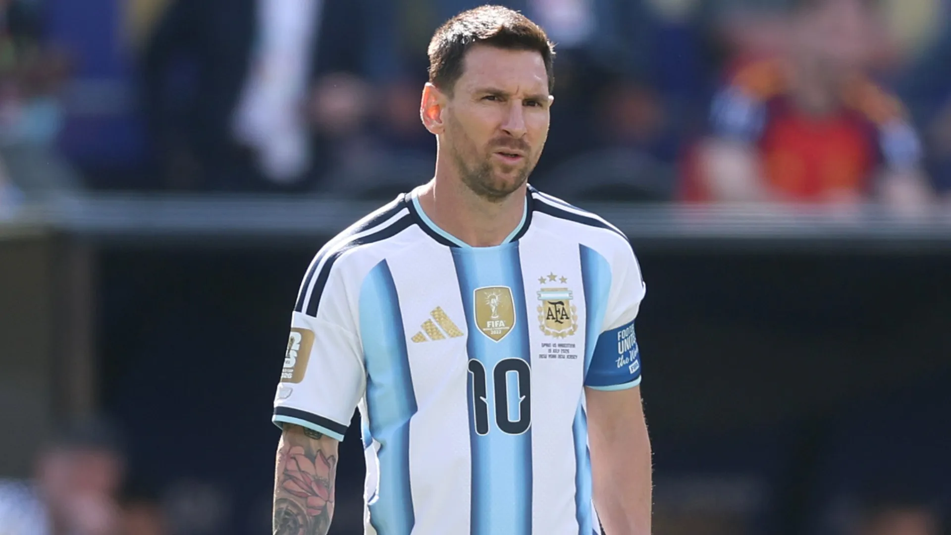 Lionel Messi looks on