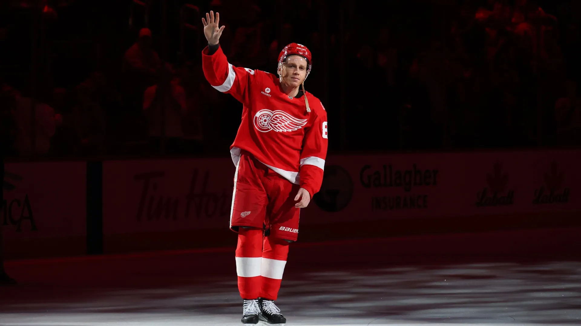 Patrick Kane #88 of the Detroit Red Wings celebrates with fans. Gregory Shamus/Getty Images