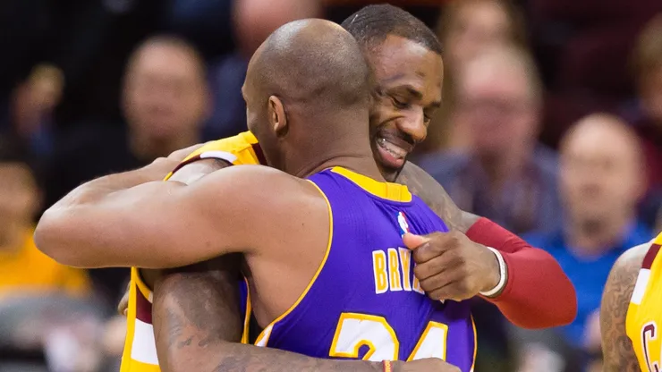 LeBron James #23 greets Kobe Bryant #24.