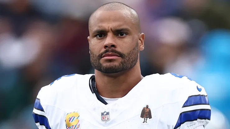 Dak Prescott #4 of the Dallas Cowboys looks on from the sideline.
