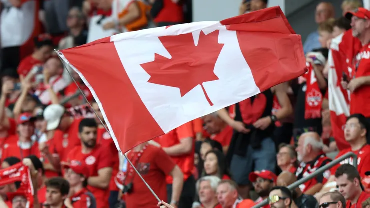 A fan of Canada waves a flag