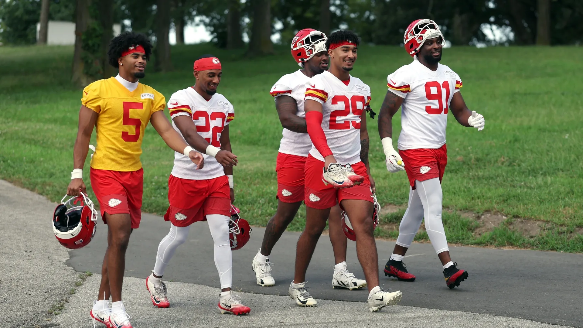 Players walk toward the practice field during Kansas City Chiefs Training Camp (Source: Jamie Squire/Getty Images)