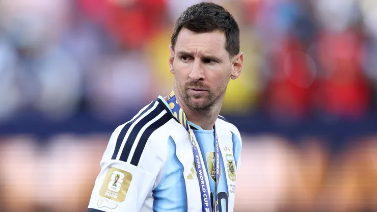 Lionel Messi #10 of Argentina looks at the World Cup trophy after losing the FIFA World Cup 2026 Final.