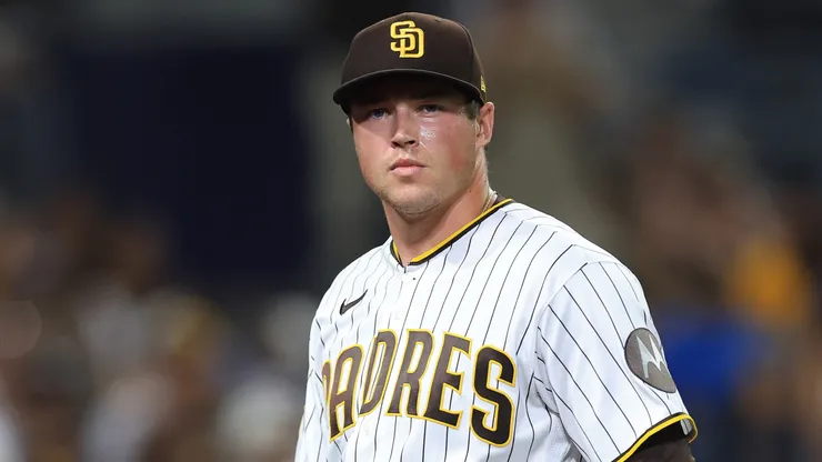 Mason Miller #22 of the San Diego Padres reacts after allowing a two RBI double.