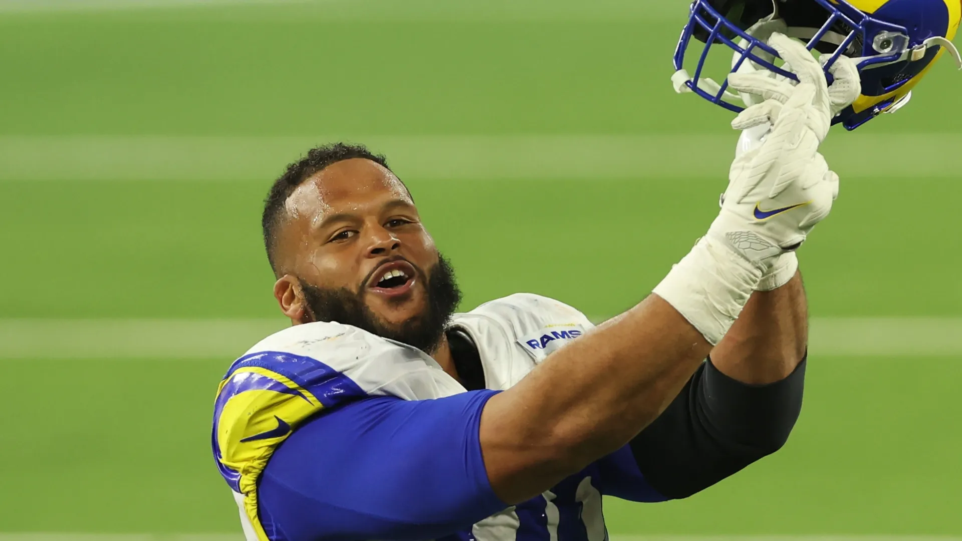 Aaron Donald points to his ring finger after winning Super Bowl LVI.