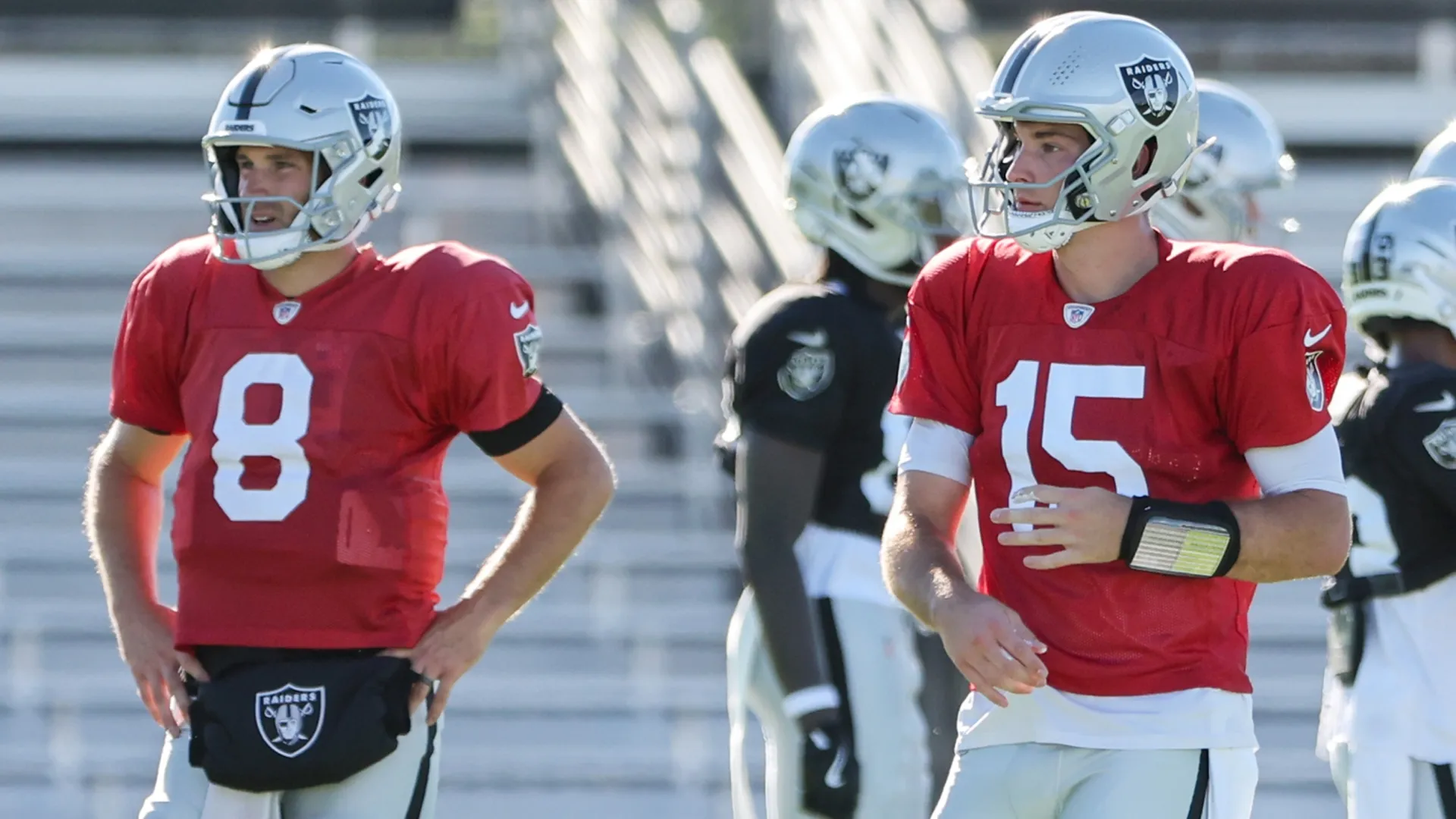 Kirk Cousins #8 and Fernando Mendoza #15 of the Las Vegas Raiders