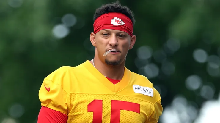 Quarterback Patrick Mahomes #15 walks toward the practice field.