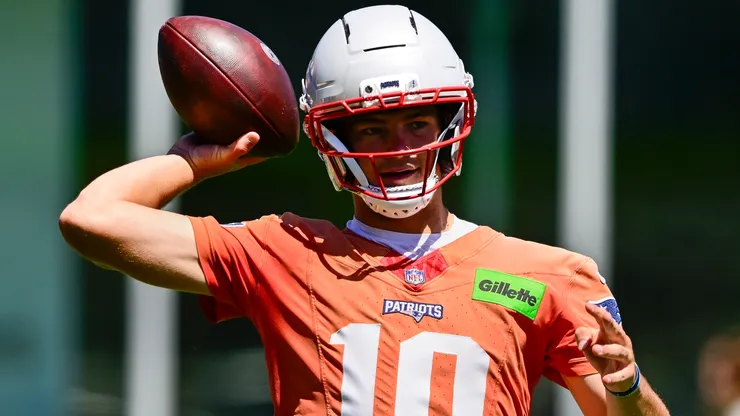 Drake Maye #10 of the New England Patriots runs a drill during a minicamp.