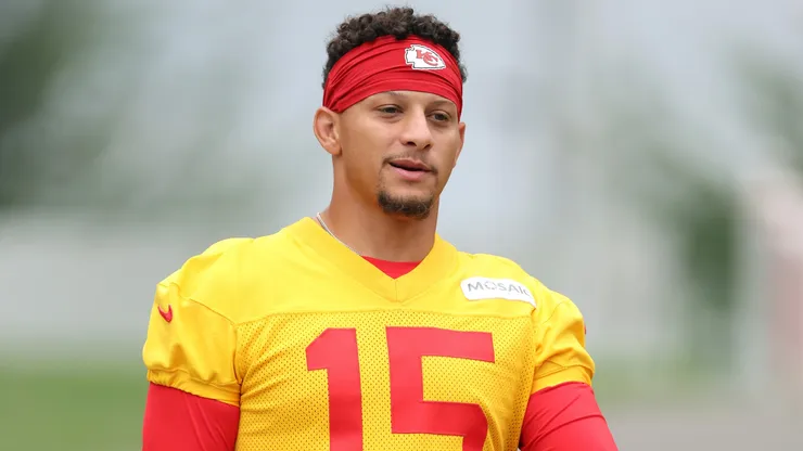 Quarterback Patrick Mahomes #15 walks toward the practice field.