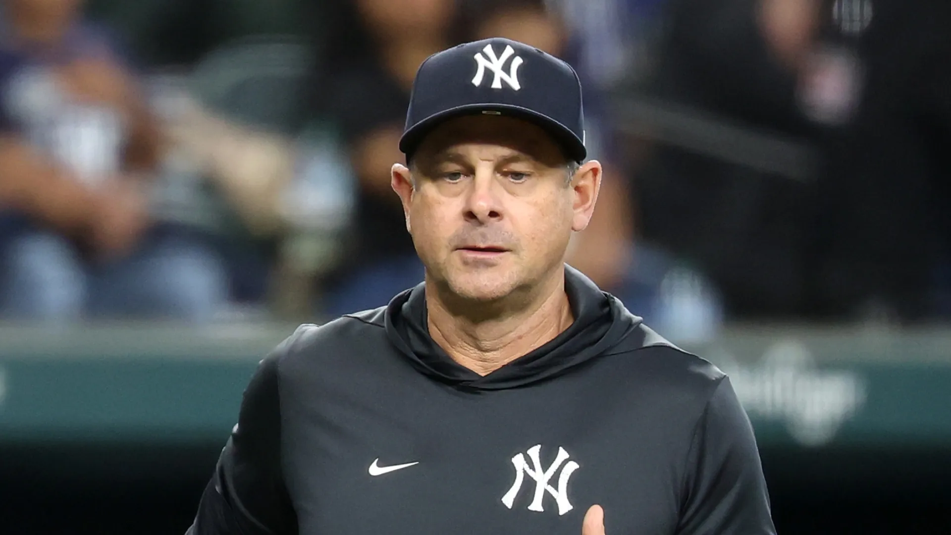 Manager Aaron Boone #17 of the New York Yankees walks to home plate during a game against the Texas Rangers at Globe Life Field on April 29, 2026 in Arlington, Texas