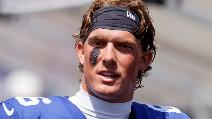 Jaxson Dart #6 of the New York Giants looks on from the sidelines.