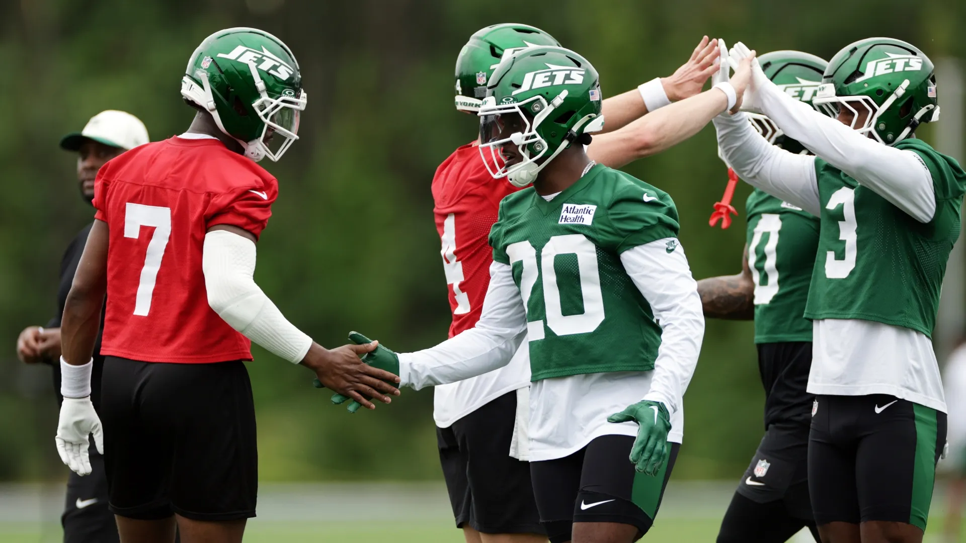 Geno Smith and Breece Hall during practice