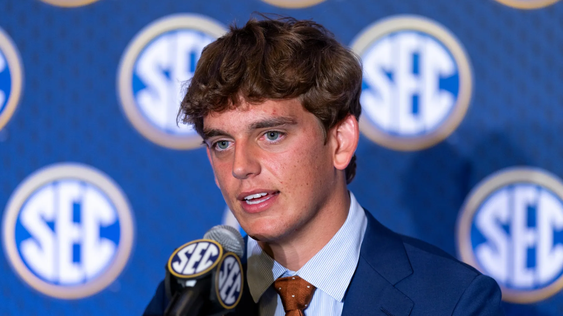 Arch Manning #16 of the Texas Longhorns speaks at SEC Football Kickoff Media Day at Tampa Marriott Water Street on July 23, 2026 in Tampa, Florida.