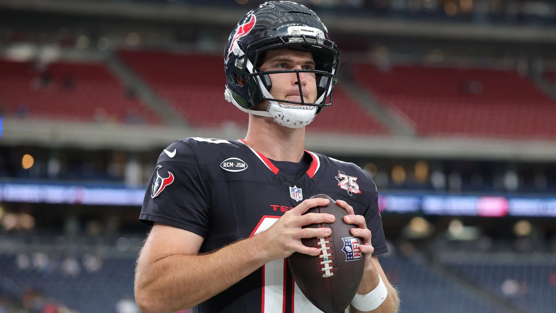 Davis Mills #10 of the Houston Texans warms up (Source: Alex Slitz/Getty Images)