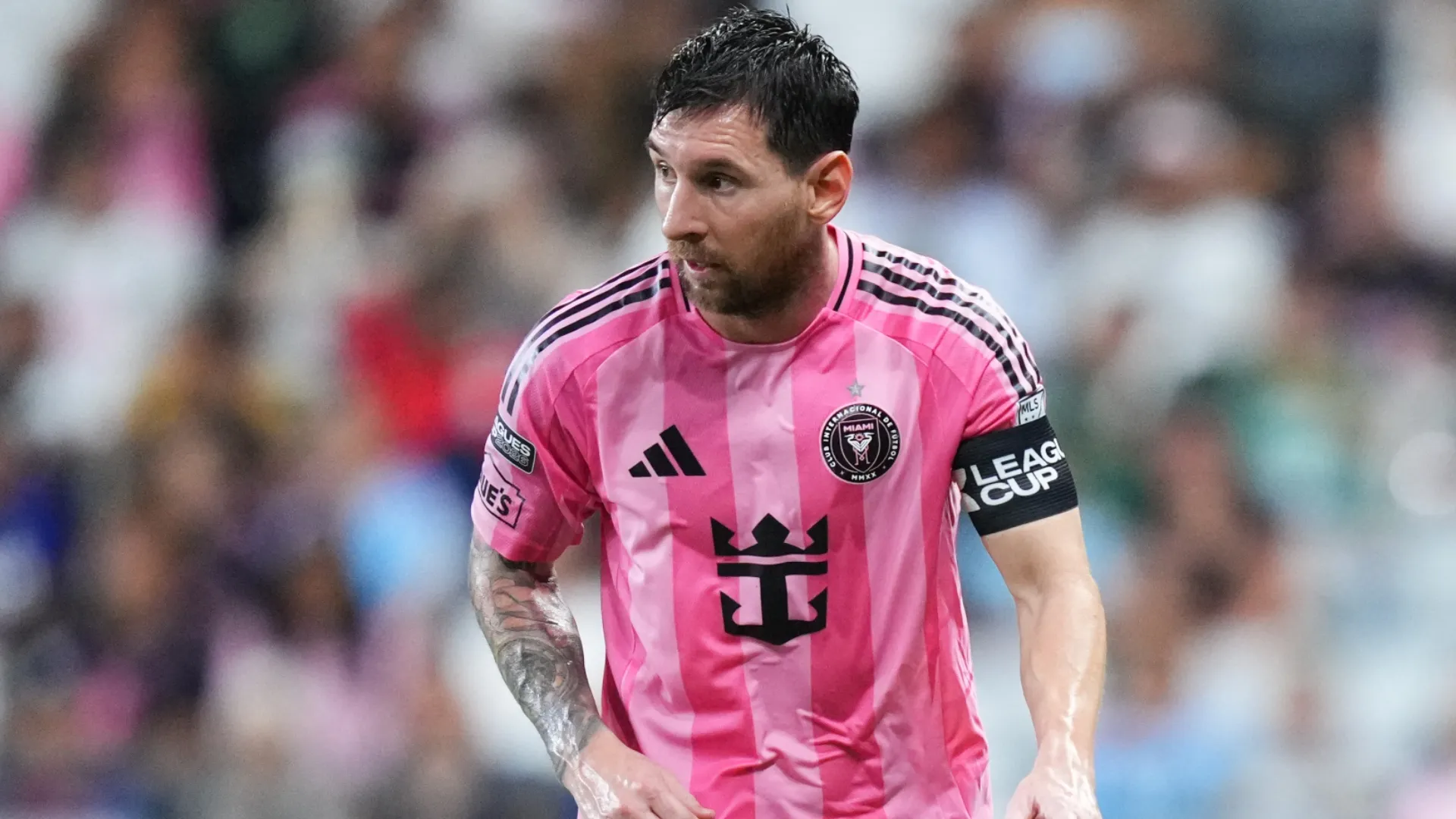 Lionel Messi looks on