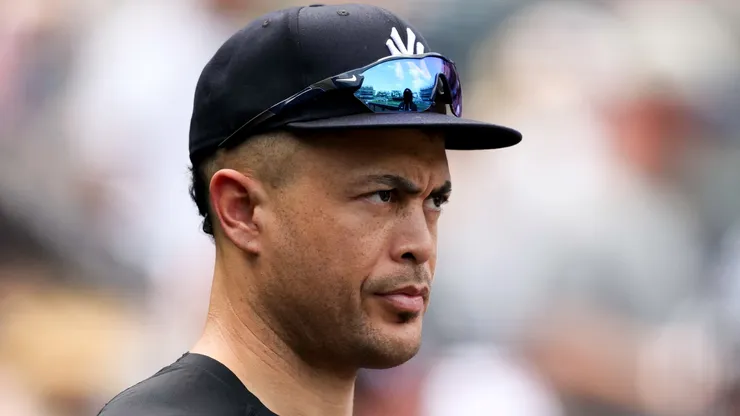 Giancarlo Stanton #27 outfield the New York Yankees looks on.