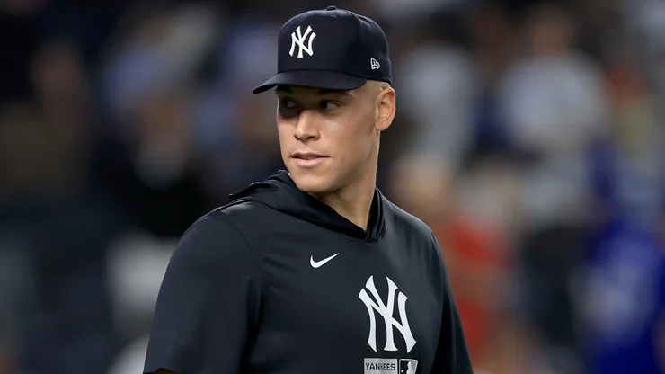 Aaron Judge #99 of the New York Yankees walks on the field.