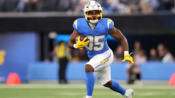 Justin Herbert #10 of the Los Angeles Chargers and Ty Simpson #15 of the Los Angeles Rams