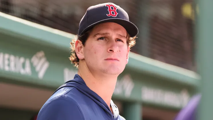 Roman Anthony #19 of the Boston Red Sox looks on from the dugout.