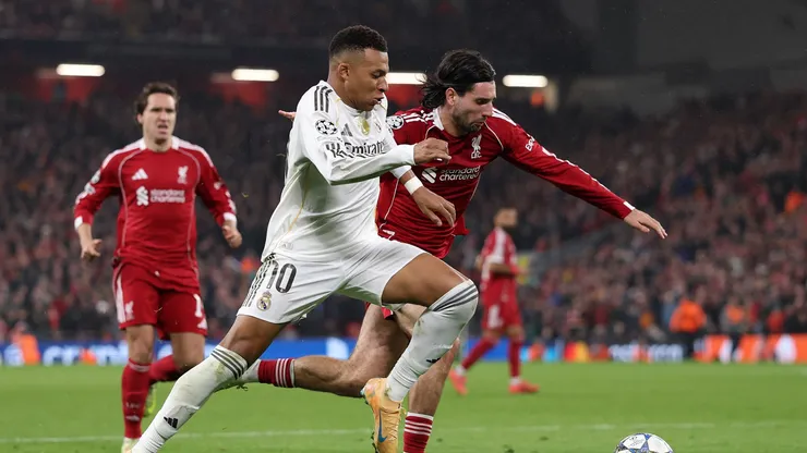 Kylian Mbappe of Real Madrid battles for possession with Dominik Szoboszlai of Liverpool.