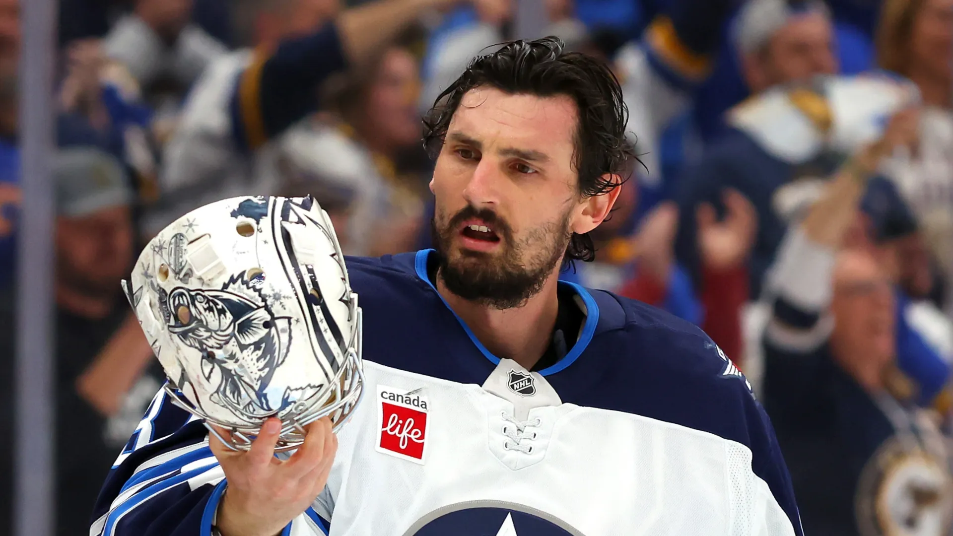 Connor Hellebuyck #37 of the Winnipeg Jets reacts against the St. Louis Blues during the first period in Game Six of the First Round of the 2025 Stanley Cup Playoffs at Enterprise Center on May 02, 2025 in St Louis, Missouri.