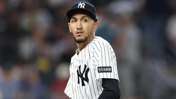 Elmer Rodríguez #71 of the New York Yankees leaves the game against the Texas Rangers.