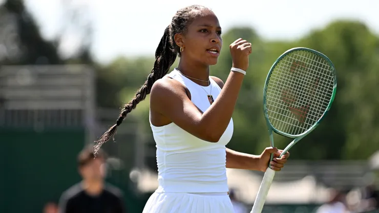 Thea Frodin celebrates in the Girl's Doubles Final during the Lexus British Open Roehampton