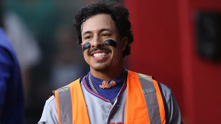 Mark Vientos #27 of the New York Mets walks in the dugout after hitting a solo home run.