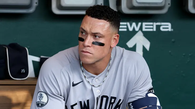 Aaron Judge #99 of the New York Yankees sits in the dugout.