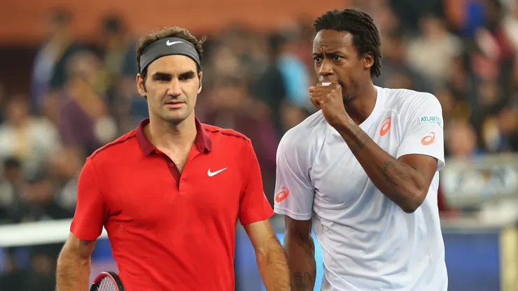 Roger Federer of the Indian Aces with his doubles partner and team mate Gael Monfils.