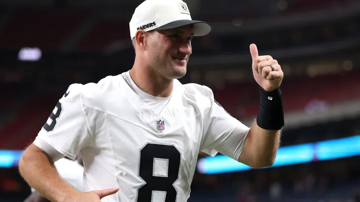 Kirk Cousins #8 of the Las Vegas Raiders gestures while running off the field.