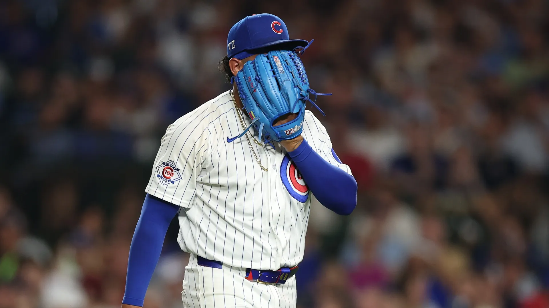 Daniel Palencia covers his face after rough outing.