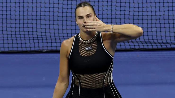 Aryna Sabalenka celebrates match point.