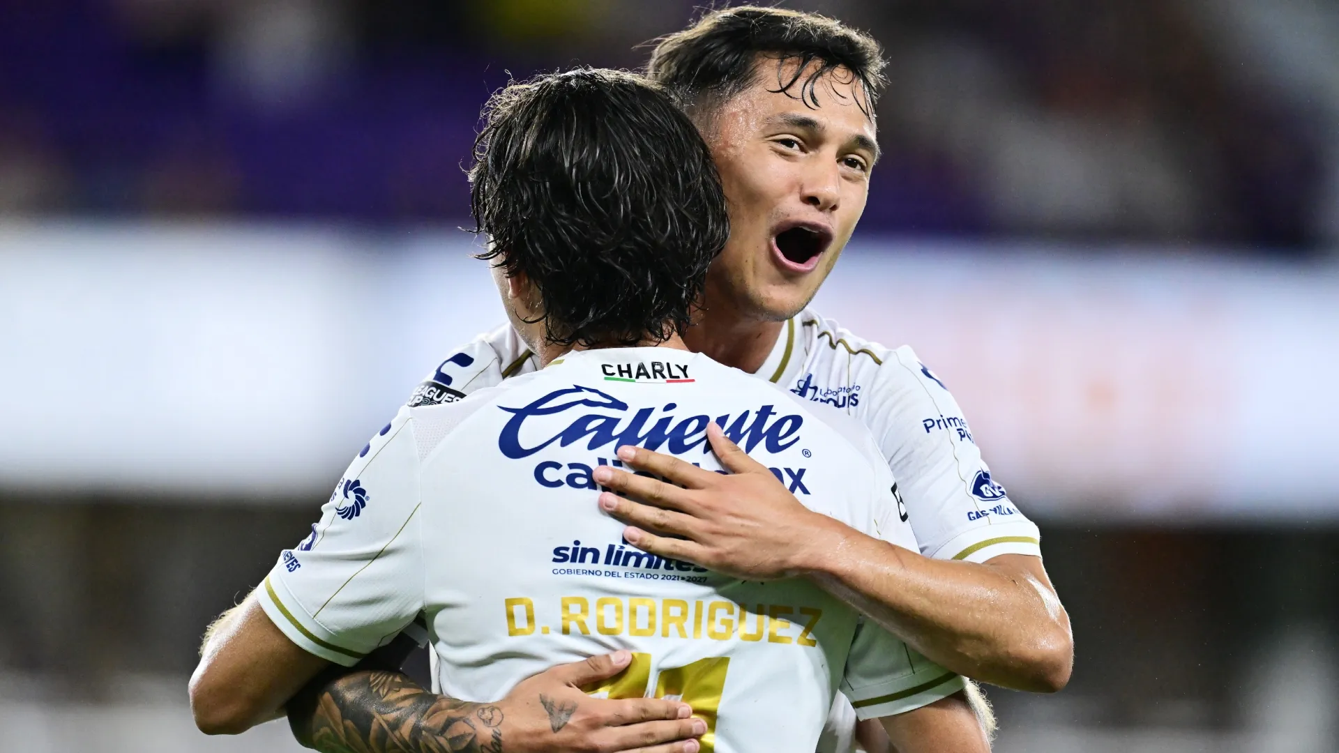 David Rodriguez and Eduardo Aguila of Atletico San Luis (Source: Julio Aguilar/Getty Images)