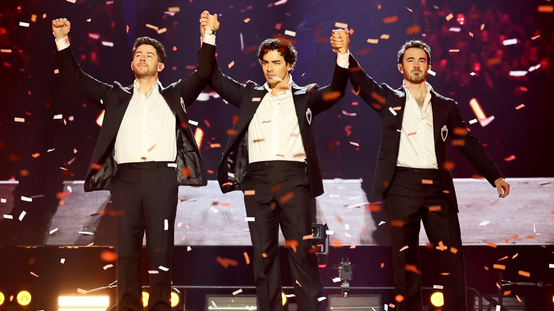 The Jonas Brothers perform onstage during Jonas Brothers: The Burning Up Tour All Over Again – New York (Source: Theo Wargo/Getty Images for Live Nation)